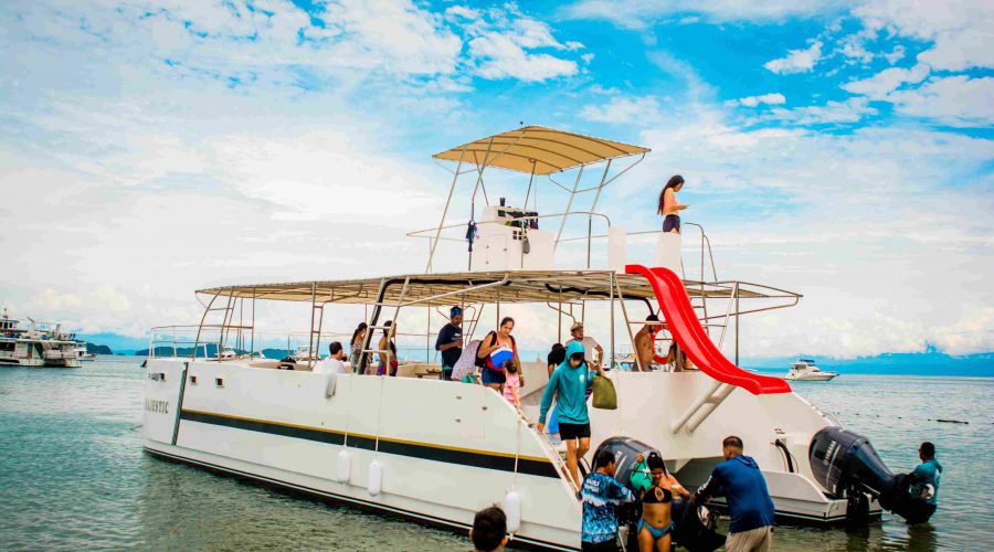 Private catamaran in Tortuga Island sailing in clear waters